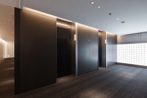 architectural surface wraps montreal public elevator in office building